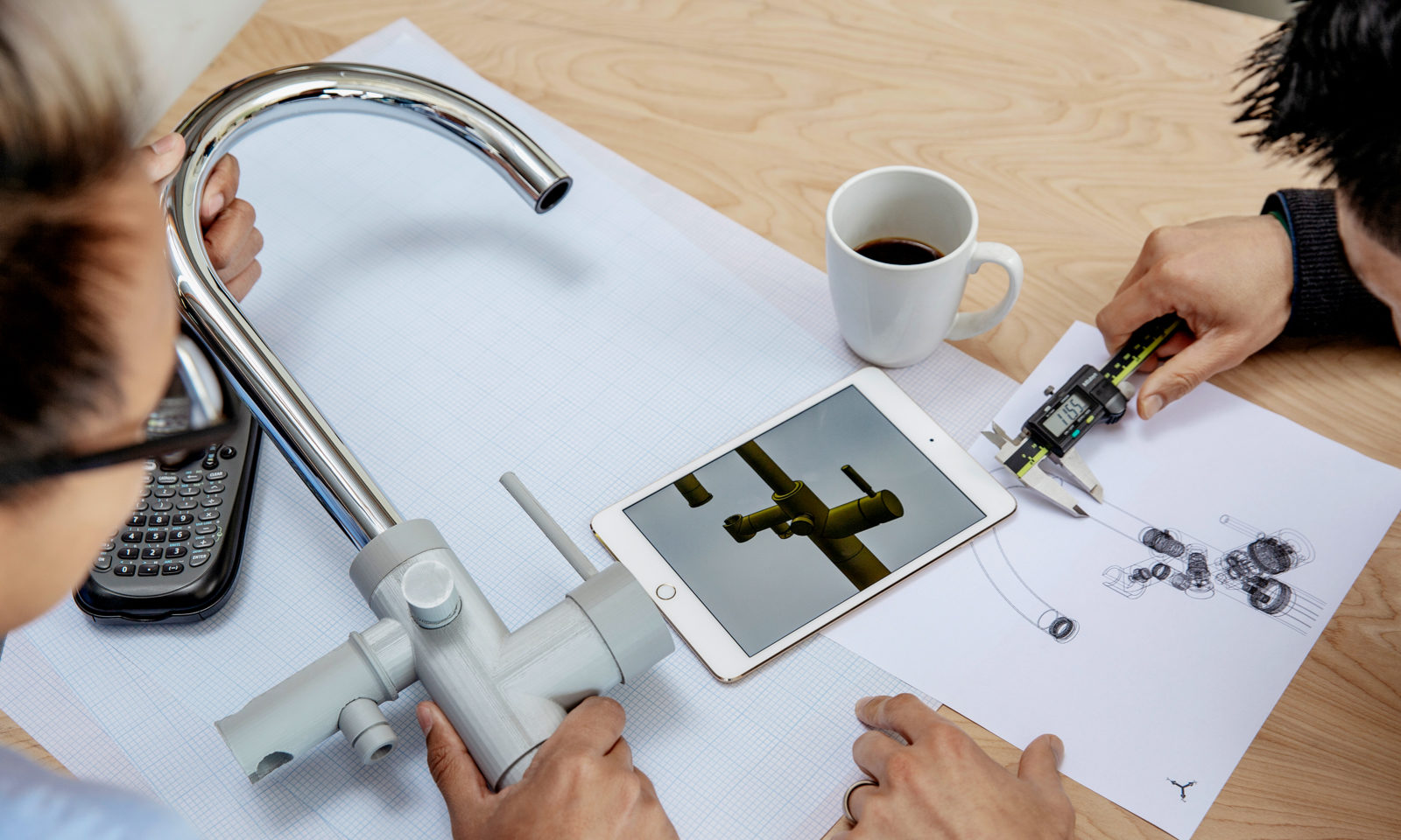 engineers measure a faucet