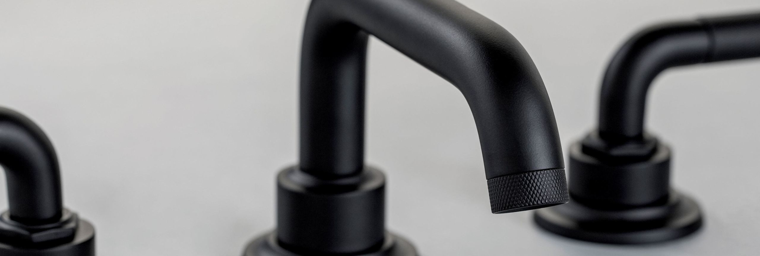 Powdercoat finish matte black on widespread faucet